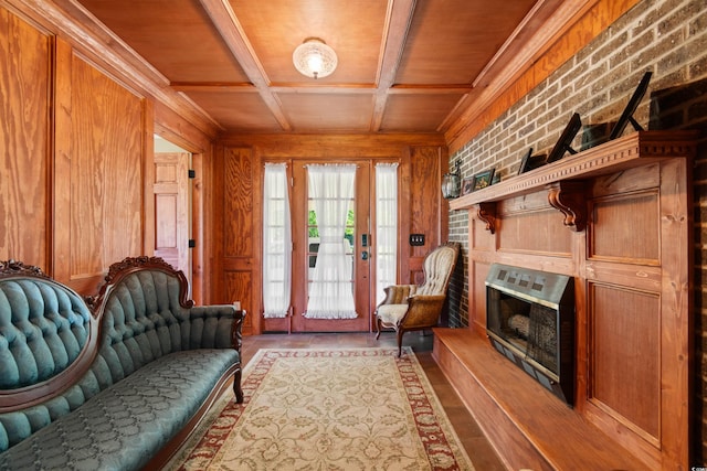 308 Old Stage Rd, Mullins, SC 29574 - living area with wood walls, wooden ceiling with exposed beams, wood finished floors, brick wall, and coffered ceiling