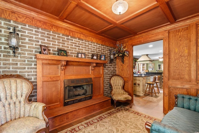 308 Old Stage Rd, Mullins, SC 29574 - living room featuring wood ceiling with exposed beams, coffered ceiling, a glass covered fireplace, brick wall, and wooden walls