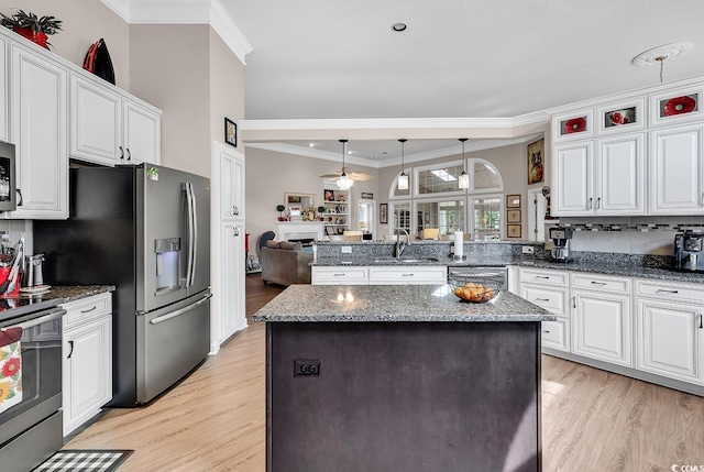6434 Longwood Dr, Murrells Inlet, SC 29576 - kitchen featuring ceiling fan, stainless steel appliances, light wood-style floors, a peninsula, and a sink