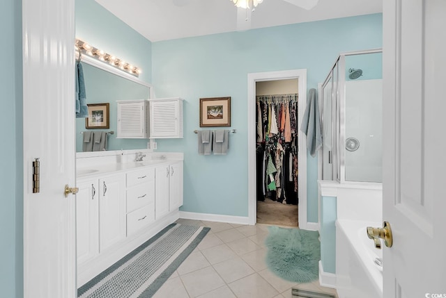 6434 Longwood Dr, Murrells Inlet, SC 29576 - bathroom featuring a stall shower, a garden tub, double vanity, tile patterned floors, and baseboards