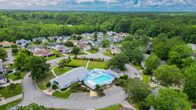 434 Deer Path, Calabash, NC 28467 - aerial view of residential area featuring a heavily wooded area and a pool area