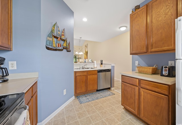 265 Connemara Dr Unit D, Myrtle Beach, SC 29579 - kitchen with appliances with stainless steel finishes, a sink, light countertops, brown cabinets, and baseboards