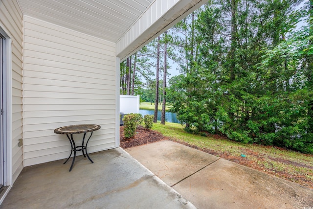 265 Connemara Dr Unit D, Myrtle Beach, SC 29579 - view of patio with a water view and view of scattered trees