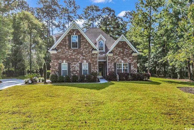 904 Moultrie Cir, Myrtle Beach, SC 29588 - traditional home with a front lawn and brick siding