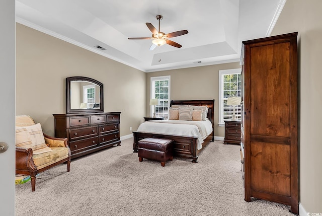 904 Moultrie Cir, Myrtle Beach, SC 29588 - bedroom with a tray ceiling, light carpet, crown molding, and ceiling fan