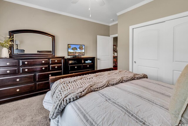 904 Moultrie Cir, Myrtle Beach, SC 29588 - bedroom with ornamental molding, carpet, a closet, and ceiling fan