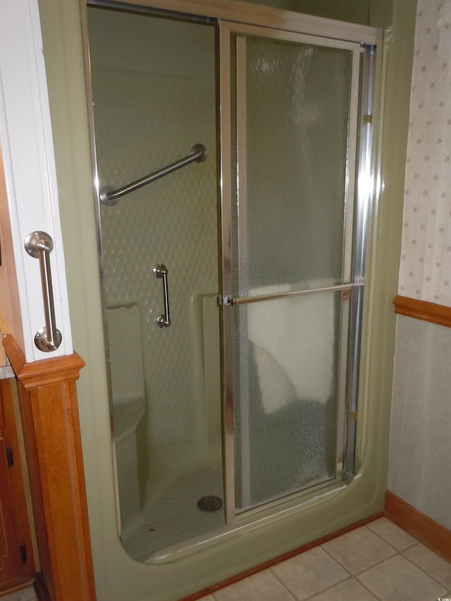 8202 Joe Brown Hwy S, Clarendon, NC 28432 - bathroom featuring a shower stall, wallpapered walls, and tile patterned floors