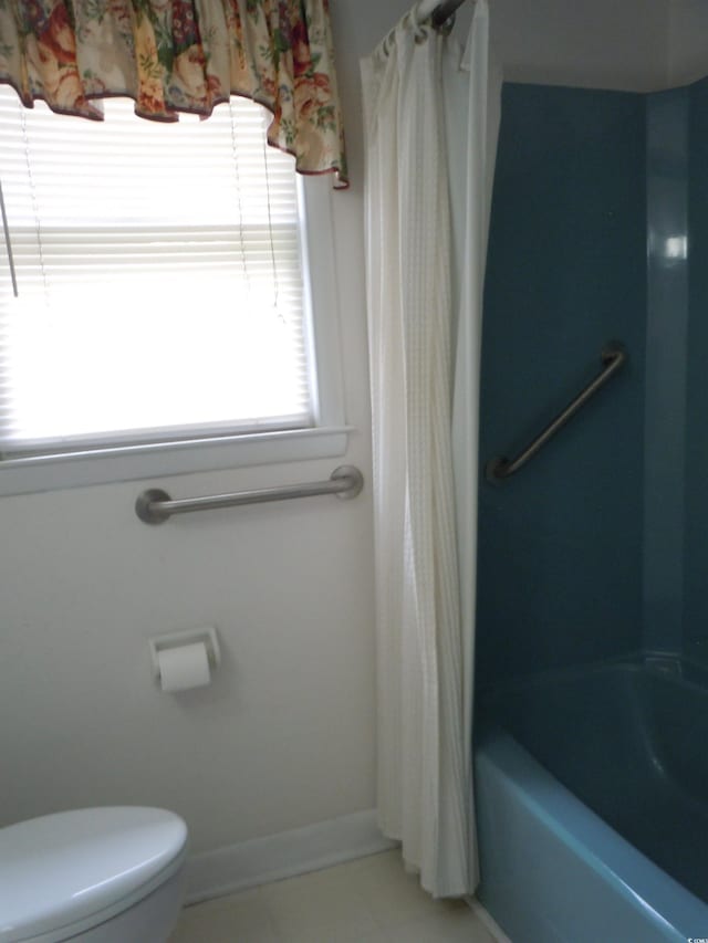 8202 Joe Brown Hwy S, Clarendon, NC 28432 - full bathroom featuring toilet, shower / tub combo with curtain, and baseboards