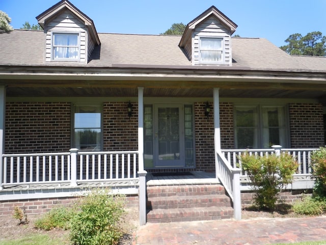 8202 Joe Brown Hwy S, Clarendon, NC 28432 - view of front facade featuring covered porch and brick siding