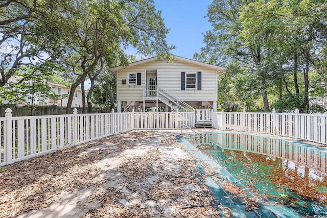 910 N Dogwood Dr, Surfside Beach, SC 29575 - rear view of house featuring a fenced backyard