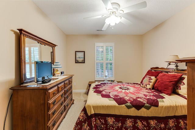 24 Gate 7, Carolina Shores, NC 28467 - bedroom with light carpet, ceiling fan, and a textured ceiling
