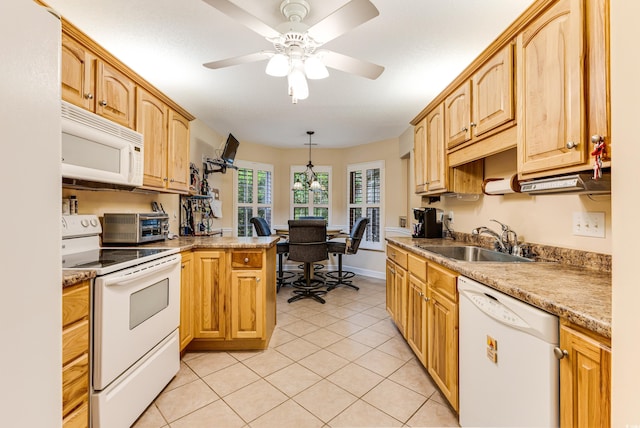 24 Gate 7, Carolina Shores, NC 28467 - kitchen with white appliances, light tile patterned floors, a peninsula, ceiling fan, and light countertops