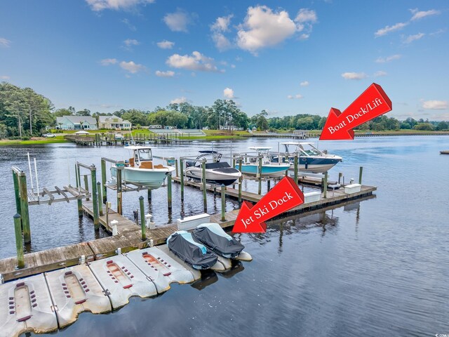 4534 Landing Rd, Little River, SC 29566 - dock area with boat lift, a water view, and view of wooded area