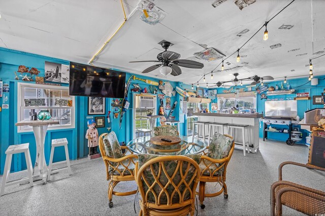 4534 Landing Rd, Little River, SC 29566 - dining area with a ceiling fan, speckle patterned floor, and healthy amount of natural light