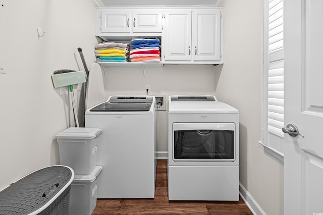 4534 Landing Rd, Little River, SC 29566 - laundry area featuring washer and clothes dryer, dark wood-type flooring, and cabinet space