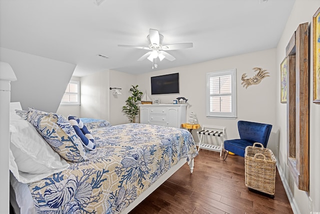 4534 Landing Rd, Little River, SC 29566 - bedroom featuring multiple windows, baseboards, and wood finished floors
