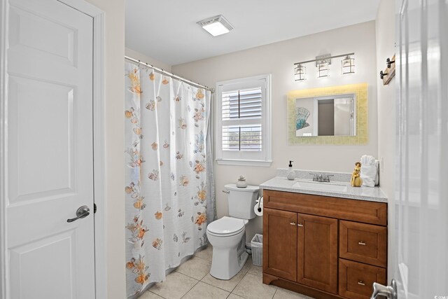 4534 Landing Rd, Little River, SC 29566 - full bathroom with toilet, vanity, tile patterned floors, and a shower with shower curtain