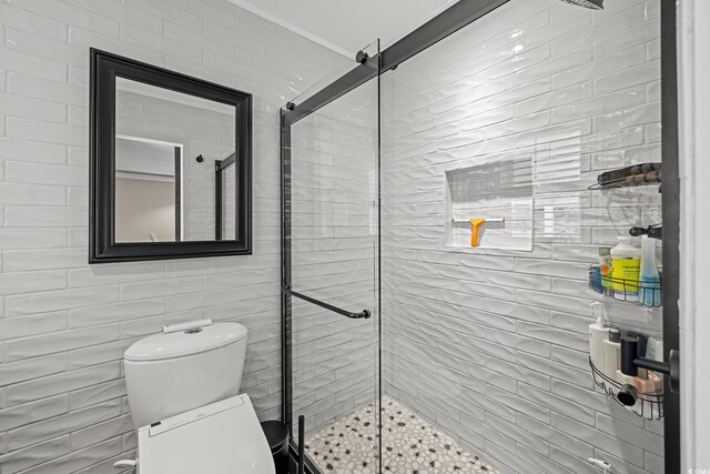 4534 Landing Rd, Little River, SC 29566 - full bath with a stall shower, toilet, and tile walls