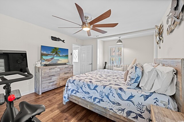 4534 Landing Rd, Little River, SC 29566 - bedroom featuring wood finished floors, a ceiling fan, and baseboards