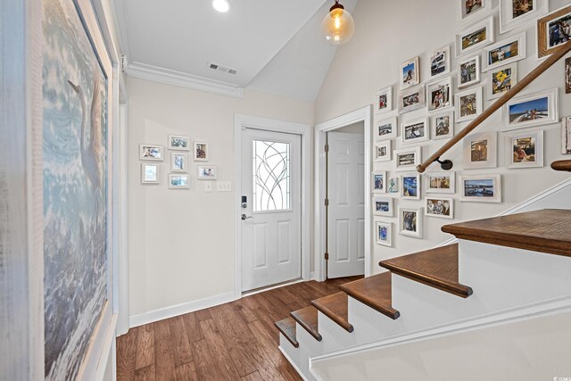 4534 Landing Rd, Little River, SC 29566 - foyer with vaulted ceiling, dark wood-style flooring, stairway, baseboards, and crown molding