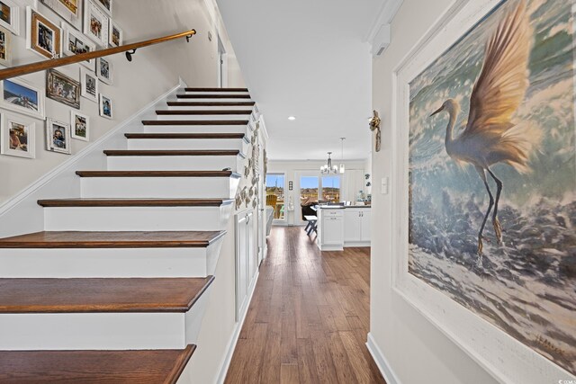 4534 Landing Rd, Little River, SC 29566 - staircase with a chandelier, wood finished floors, recessed lighting, and baseboards
