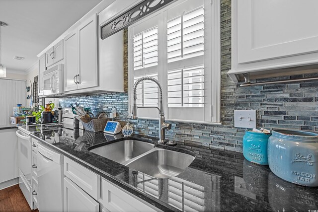 4534 Landing Rd, Little River, SC 29566 - kitchen featuring a sink, white appliances, backsplash, white cabinetry, and ornamental molding