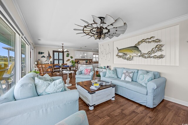 4534 Landing Rd, Little River, SC 29566 - living room with a chandelier, crown molding, dark wood-style flooring, ceiling fan, and baseboards