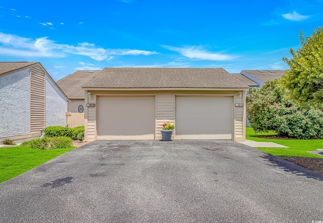 4018 Fairway Lakes Dr Unit 4018, Myrtle Beach, SC 29577 - view of front of house featuring driveway, a garage, and roof with shingles