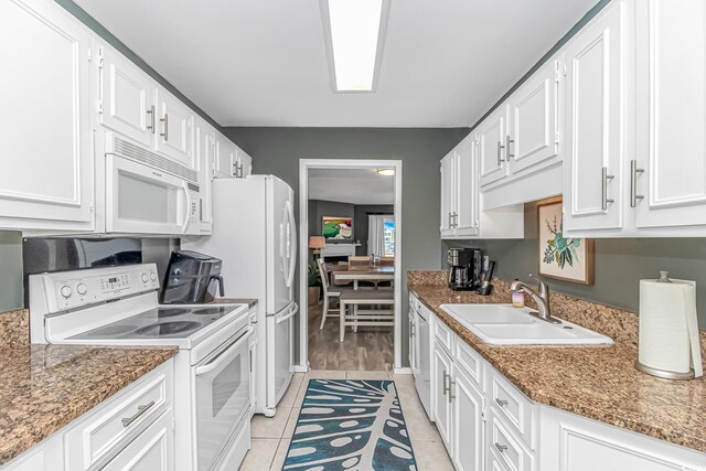 4018 Fairway Lakes Dr Unit 4018, Myrtle Beach, SC 29577 - kitchen featuring white appliances, white cabinetry, light tile patterned floors, and light stone counters