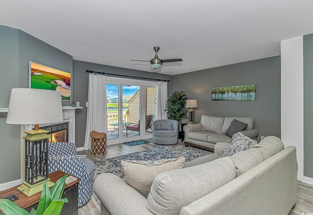 4018 Fairway Lakes Dr Unit 4018, Myrtle Beach, SC 29577 - living area featuring ceiling fan, wood finished floors, and a lit fireplace