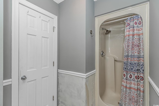 4018 Fairway Lakes Dr Unit 4018, Myrtle Beach, SC 29577 - bathroom with curtained shower and wainscoting