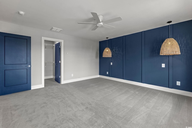 135B Sunset Dr, Murrells Inlet, SC 29576 - unfurnished bedroom featuring carpet floors, baseboards, a spacious closet, ceiling fan, and a closet
