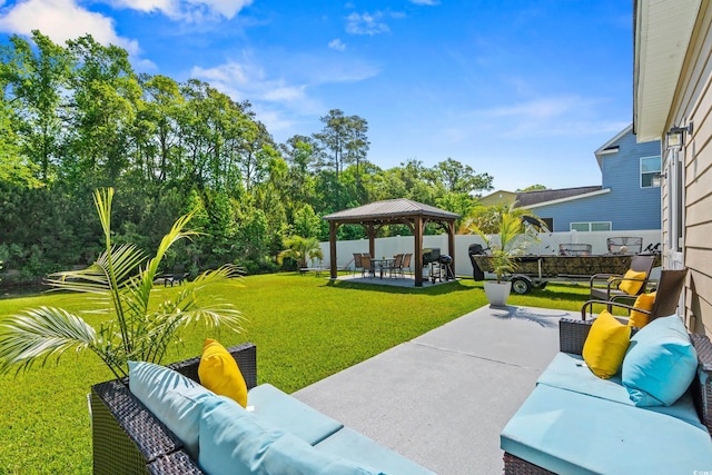 309 Foxpath Loop, Myrtle Beach, SC 29588 - fenced backyard with an outdoor hangout area, a gazebo, and a patio