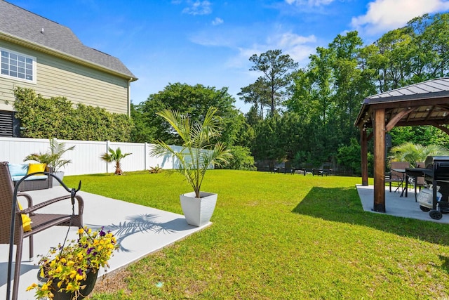 309 Foxpath Loop, Myrtle Beach, SC 29588 - fenced backyard with a gazebo and a patio area