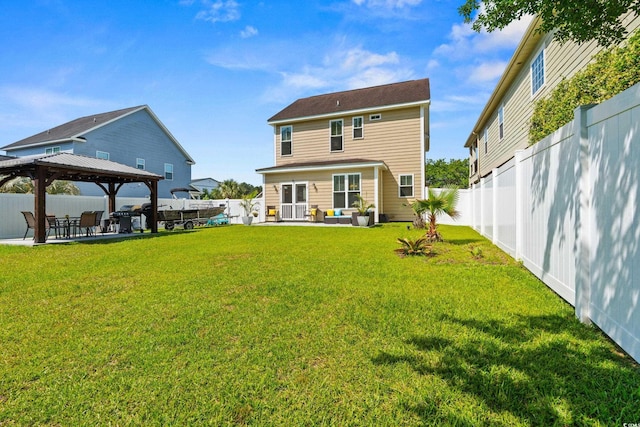309 Foxpath Loop, Myrtle Beach, SC 29588 - back of property with a gazebo, outdoor lounge area, a patio, and a fenced backyard