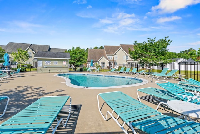 309 Foxpath Loop, Myrtle Beach, SC 29588 - community pool with a patio area and a residential view