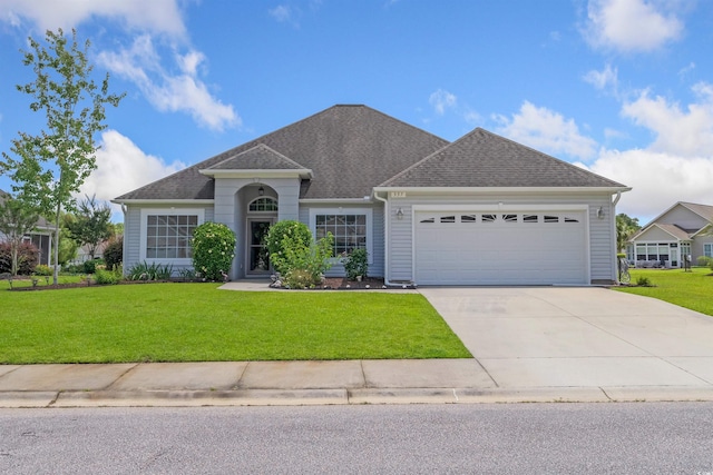 357 Southern Breezes Cir, Murrells Inlet, SC 29576 - view of front of home featuring a garage, a front lawn, concrete driveway, and a shingled roof