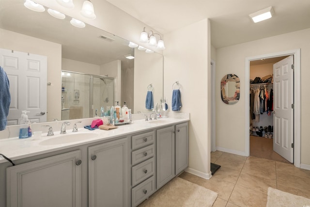 357 Southern Breezes Cir, Murrells Inlet, SC 29576 - full bath featuring a stall shower, double vanity, a spacious closet, and tile patterned floors