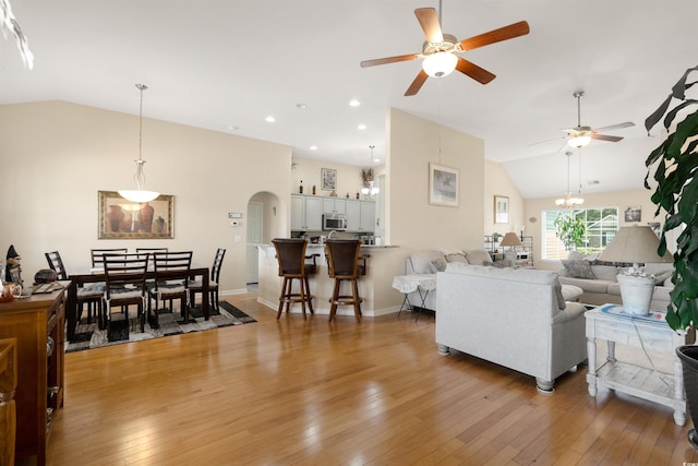 357 Southern Breezes Cir, Murrells Inlet, SC 29576 - living area with lofted ceiling, ceiling fan, light wood-style floors, and arched walkways