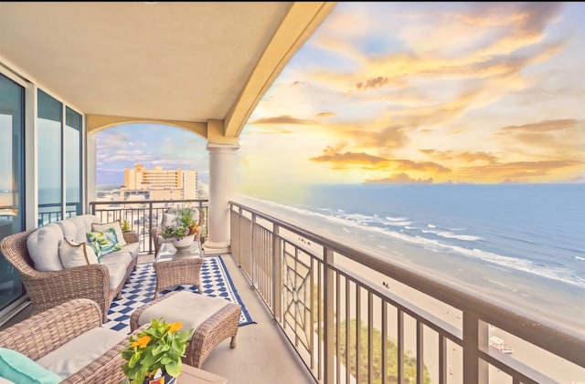 603 S Ocean Blvd Unit 1504, North Myrtle Beach, SC 29582 - balcony at dusk featuring an outdoor hangout area and view of water and beach