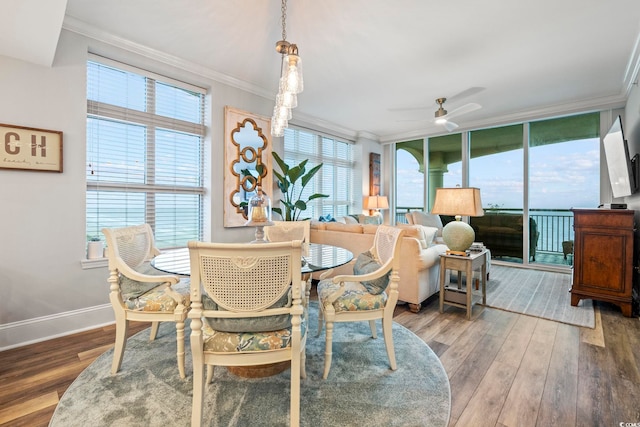 603 S Ocean Blvd Unit 1504, North Myrtle Beach, SC 29582 - dining area featuring ornamental molding, wood finished floors, and ceiling fan