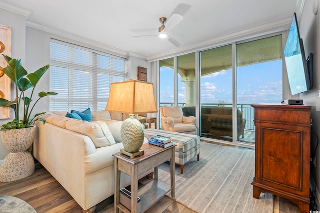 603 S Ocean Blvd Unit 1504, North Myrtle Beach, SC 29582 - living room featuring ornamental molding, wood finished floors, a ceiling fan, and a wall of windows