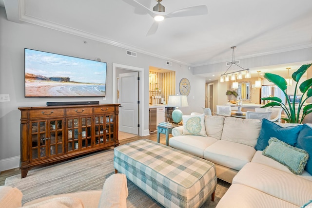 603 S Ocean Blvd Unit 1504, North Myrtle Beach, SC 29582 - living area featuring light wood-style flooring, a ceiling fan, and ornamental molding