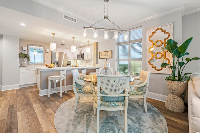 603 S Ocean Blvd Unit 1504, North Myrtle Beach, SC 29582 - dining room featuring crown molding, healthy amount of natural light, light wood-style flooring, and recessed lighting