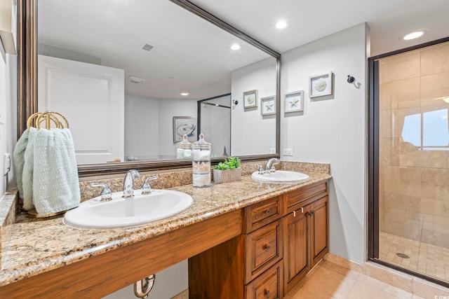603 S Ocean Blvd Unit 1504, North Myrtle Beach, SC 29582 - bathroom with a shower stall, double vanity, recessed lighting, and tile patterned floors