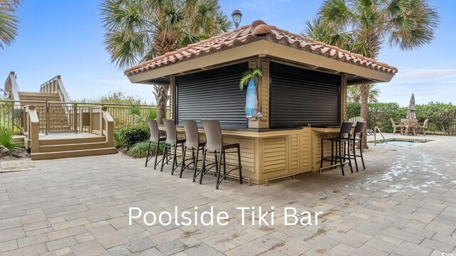 603 S Ocean Blvd Unit 1504, North Myrtle Beach, SC 29582 - view of patio / terrace with a wooden deck and a pool