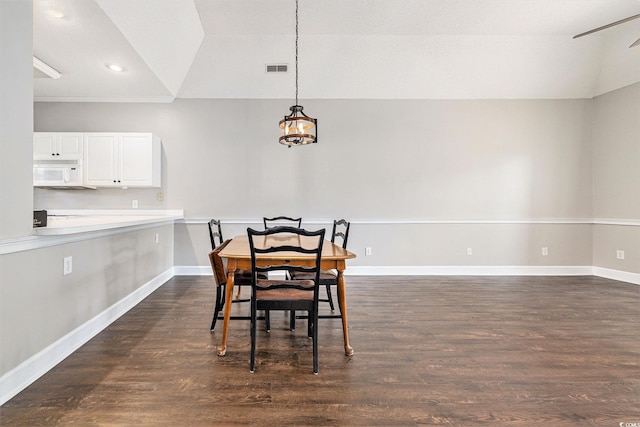 4721 Hibiscus Dr Unit 3-302, Little River, SC 29566 - dining area featuring vaulted ceiling, dark wood finished floors, and a chandelier