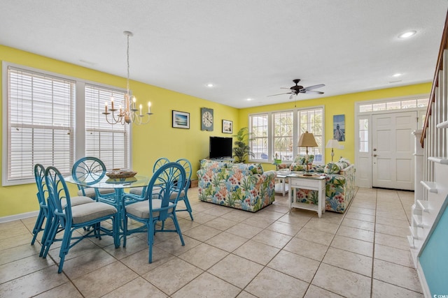 22 Ocean Blvd N, Surfside Beach, SC 29575 - dining area with a chandelier, light tile patterned flooring, a ceiling fan, recessed lighting, and stairway