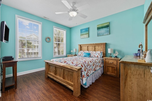 22 Ocean Blvd N, Surfside Beach, SC 29575 - bedroom with dark wood-style floors, a ceiling fan, and a textured ceiling