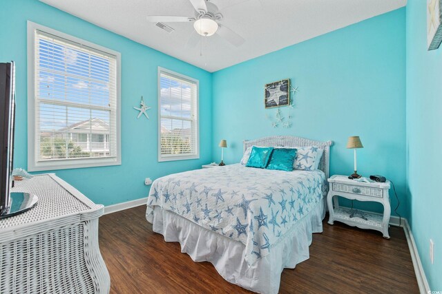 22 Ocean Blvd N, Surfside Beach, SC 29575 - bedroom with wood finished floors and ceiling fan